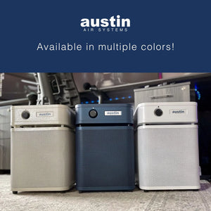 Three air purifiers from Austin Air Systems on a carpeted floor with a blue banner at the top.