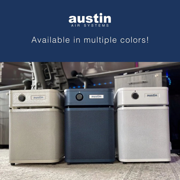 Three air purifiers from Austin Air Systems on a carpeted floor with a blue banner at the top.