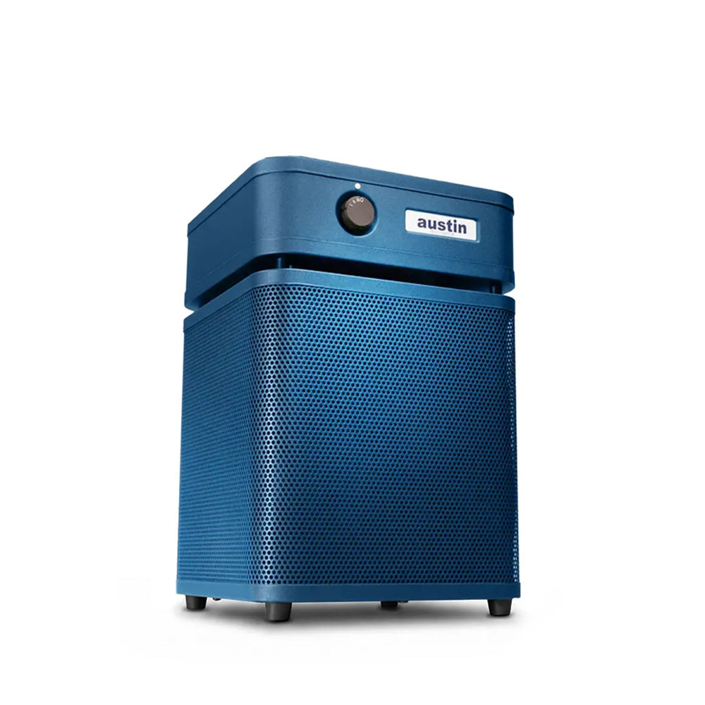 White air purifier standing at a 3/4 angle in midnight blue color