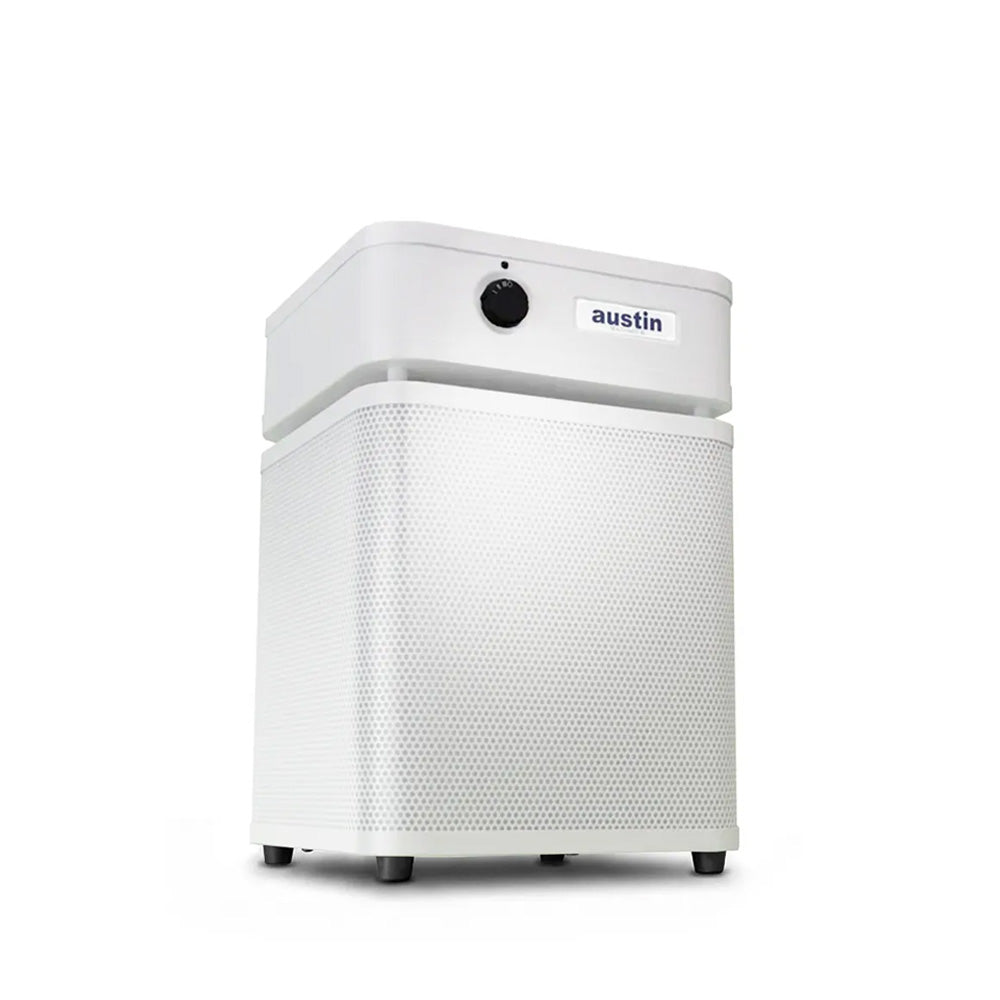White air purifier standing at a 3/4 angle in midnight blue color