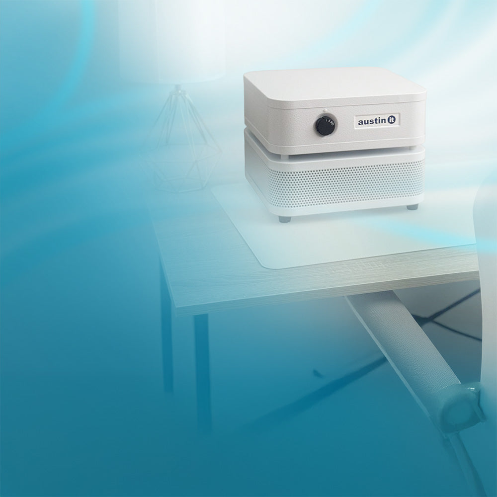 White air purifier Austin It on a desk with a blue gradient background